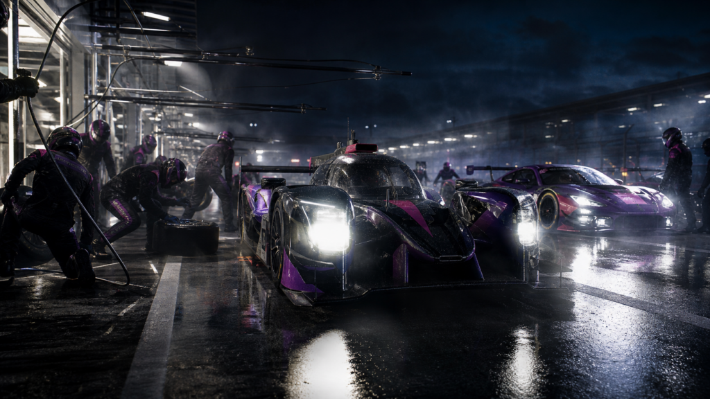 Night endurance pit lane with GT cars and headlights for Le Mans Ultimate 2026 update news